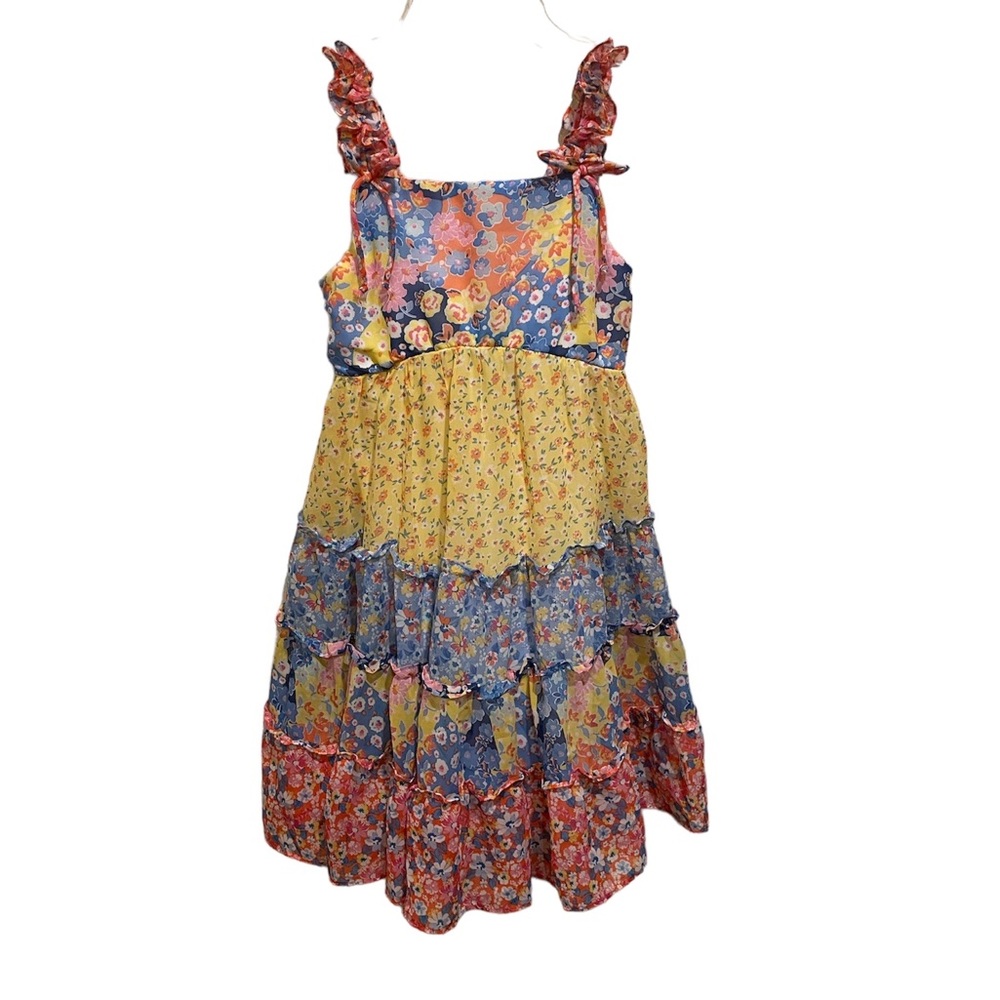 Jona Michelle tiered pastel floral dress with ruffled straps. Bows accents strap